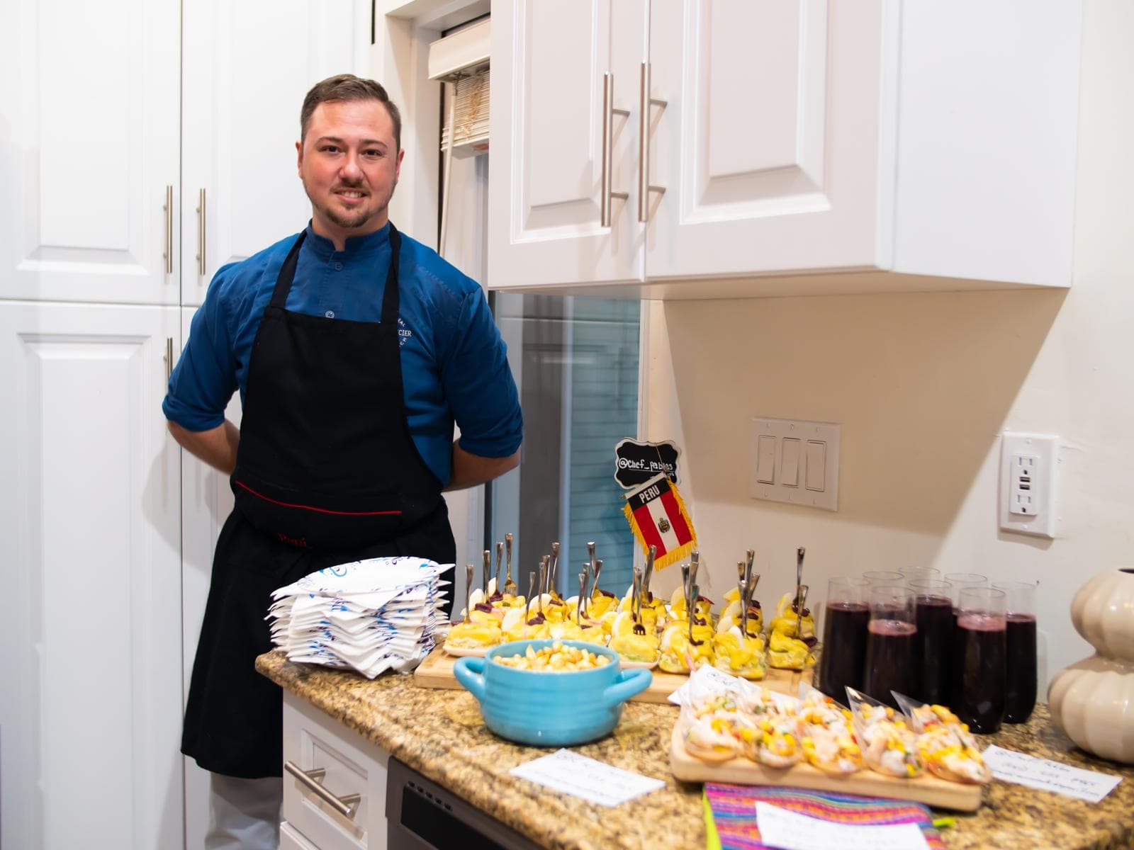 Chef Pablo with a spread of Peruvian dishes