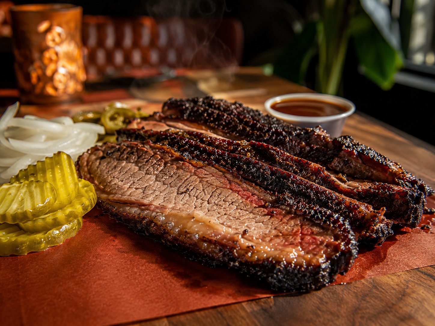 Chef Pablo's slow-smoked brisket, sliced to order with a deep peppered bark and warm charred edges